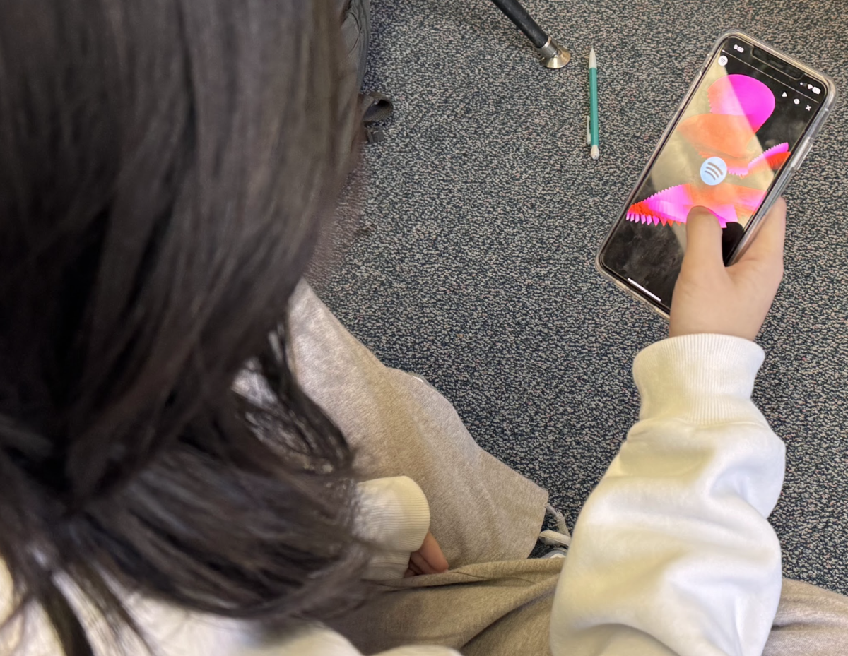 Amber Wang ('27) sits down to watch her Spotify Wrapped